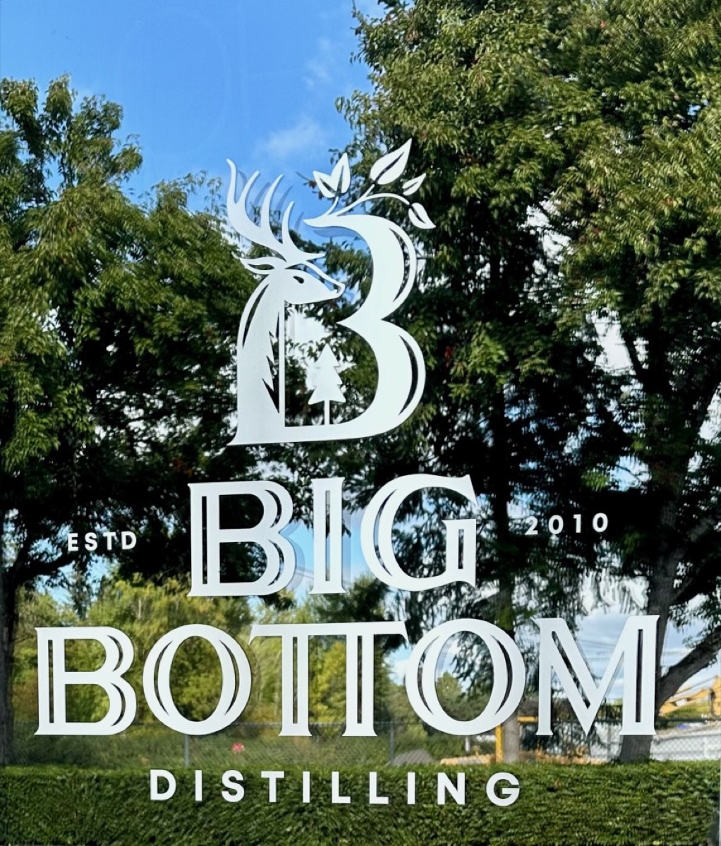 The Big Bottom Distilling logo on the tasting room window